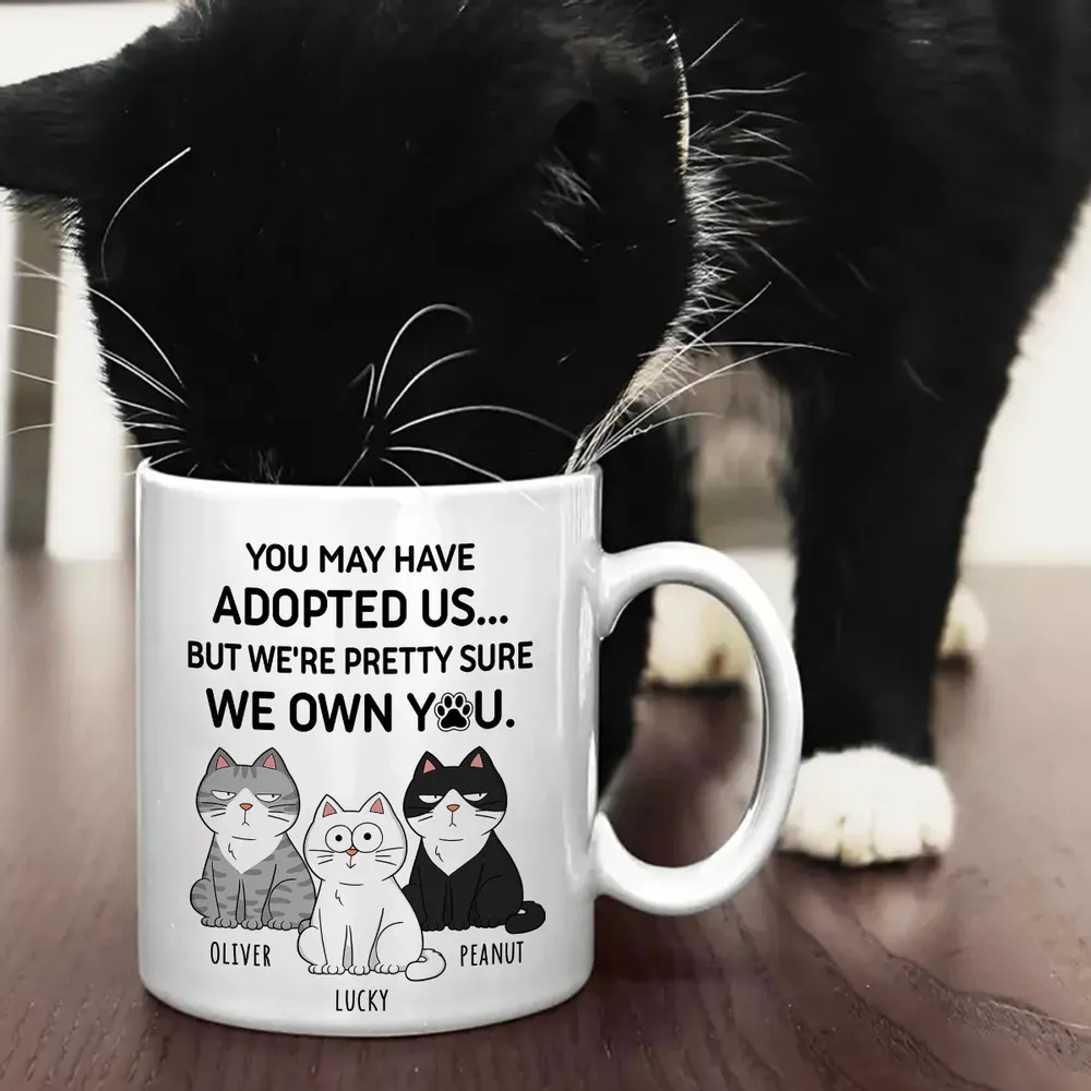 You May Have Adopted Us… But We Own You – Personalized Cat Lover White Ceramic Mug - Image 5